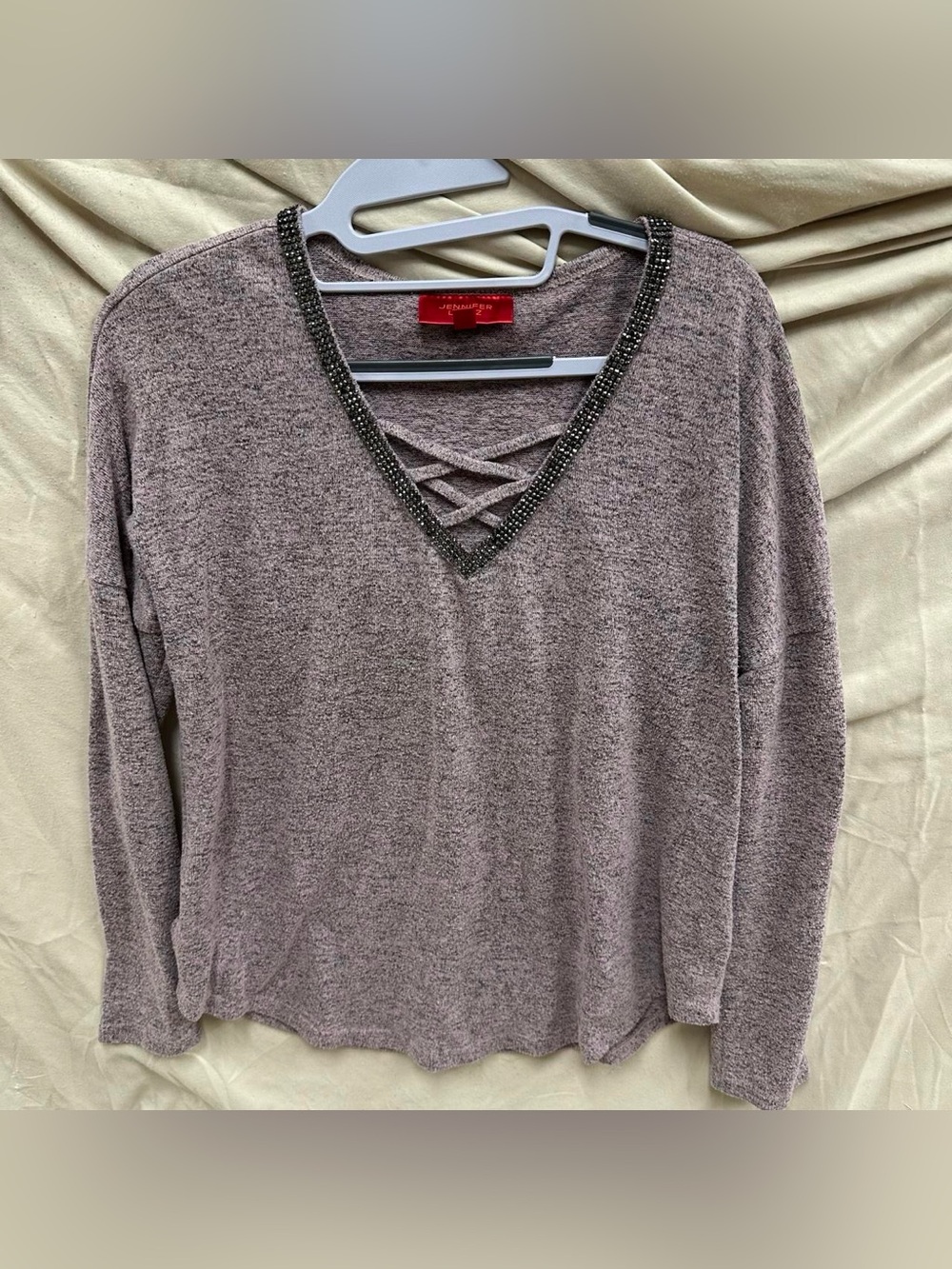 Jennifer Lopez official black rhinestone v neck light purple long sleeve.